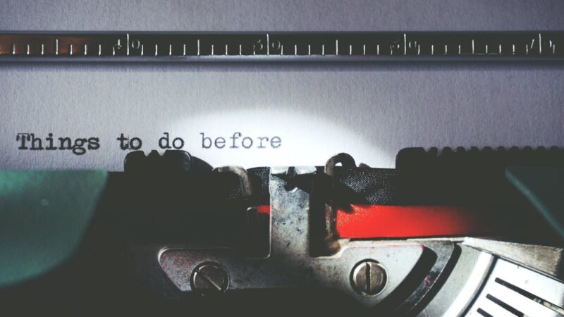 Close-up of a vintage typewriter typing 'Things to do before'.